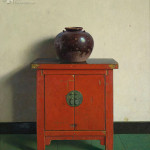 Chinese pot on red chest